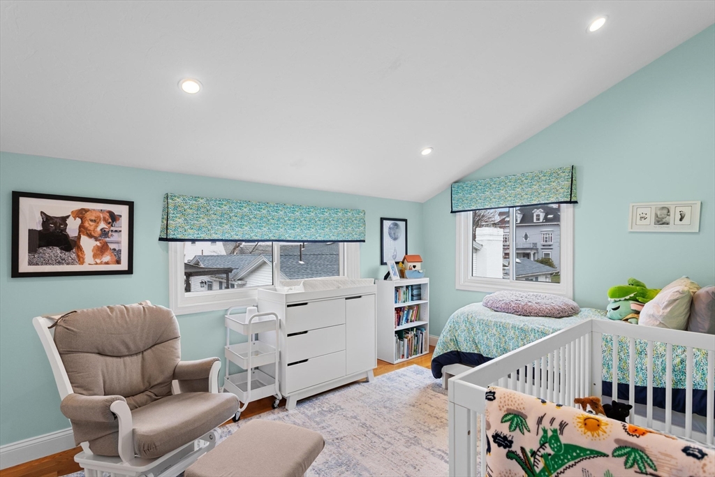 2 Chase Lane, Unit 2 Lynn, MA 01902 - Photo 26 of 42 a bedroom with furniture and a wooden floor