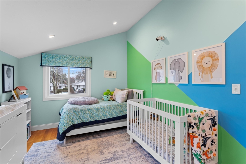 2 Chase Lane, Unit 2 Lynn, MA 01902 - Photo 27 of 42 a bedroom with three beds and a baby crib