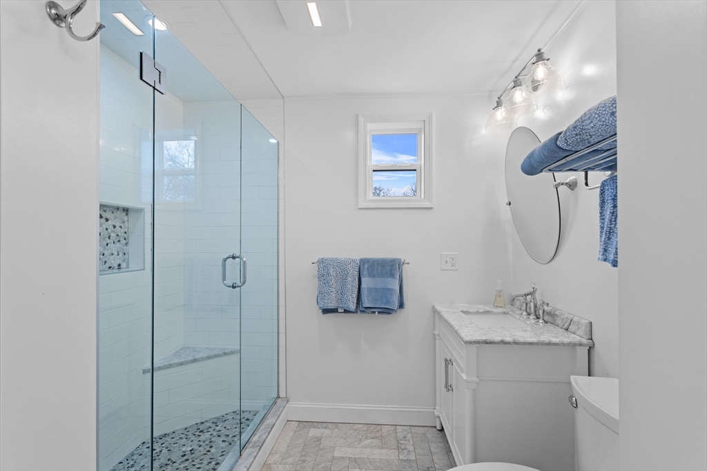 2 Chase Lane, Unit 2 Lynn, MA 01902 - Photo 29 of 42 a bathroom with a shower a sink and mirror