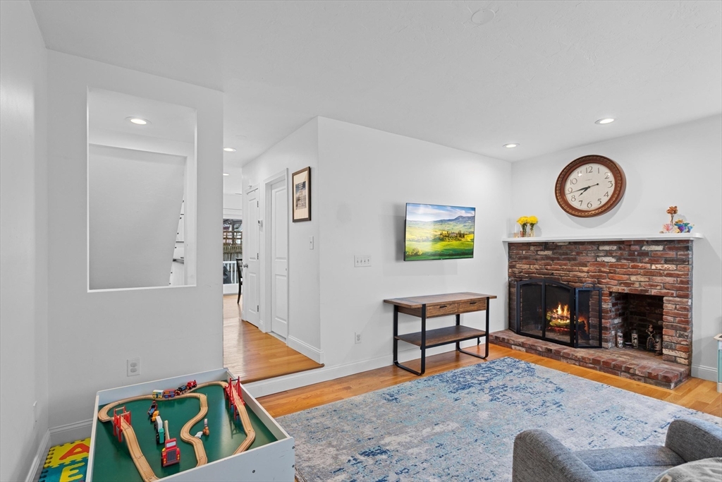 2 Chase Lane, Unit 2 Lynn, MA 01902 - Photo 3 of 42 a living room with furniture and a fireplace