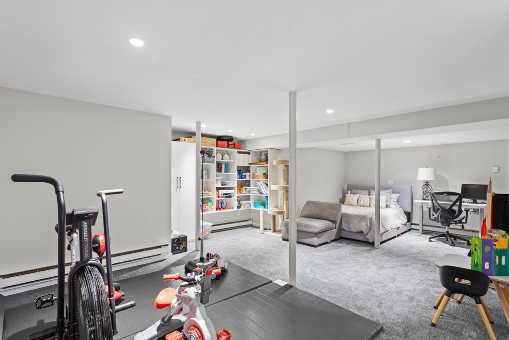 2 Chase Lane, Unit 2 Lynn, MA 01902 - Photo 32 of 42 a living room with furniture and a gym equipment