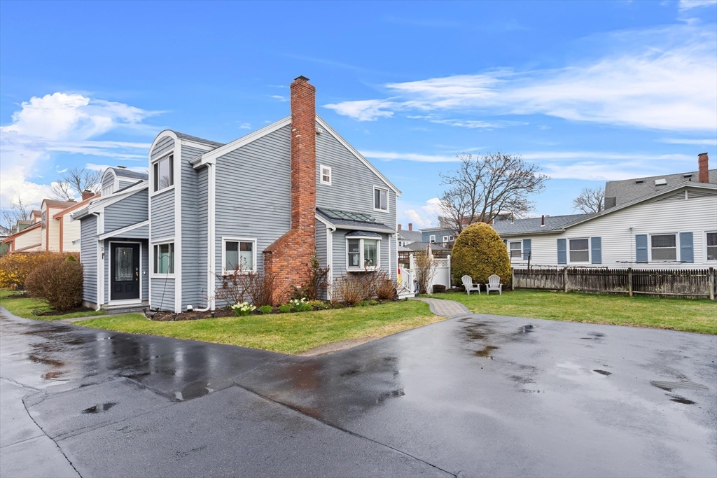 2 Chase Lane, Unit 2 Lynn, MA 01902 - Photo 36 of 42 a view of a house with a yard