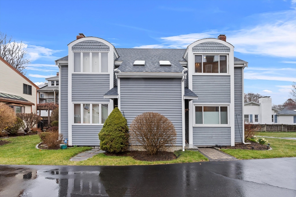 2 Chase Lane, Unit 2 Lynn, MA 01902 - Photo 37 of 42 a front view of a house with a yard