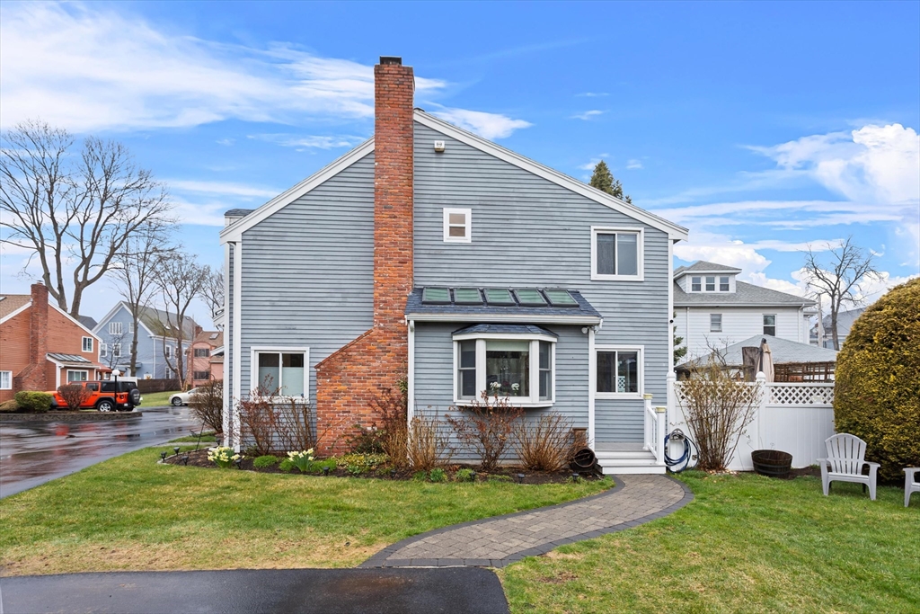 2 Chase Lane, Unit 2 Lynn, MA 01902 - Photo 38 of 42 a front view of a house with a yard