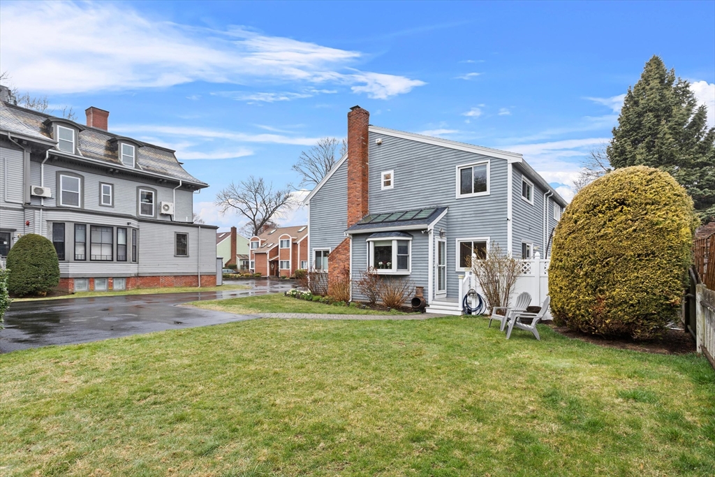 2 Chase Lane, Unit 2 Lynn, MA 01902 - Photo 39 of 42 a view of a house with a big yard and large trees