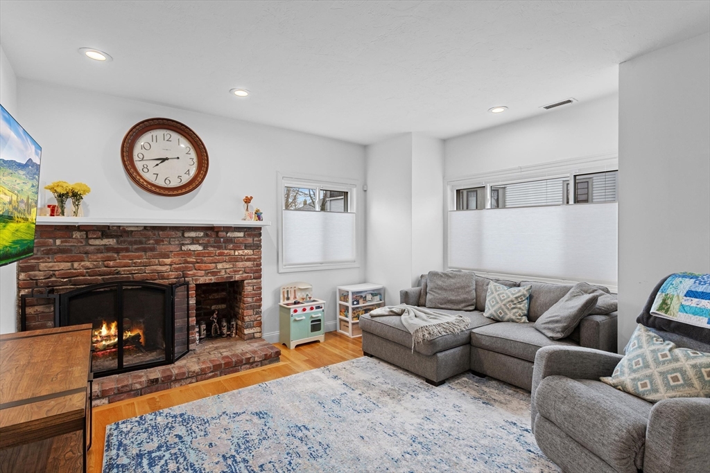 2 Chase Lane, Unit 2 Lynn, MA 01902 - Photo 8 of 42 a living room with furniture a clock and a fireplace