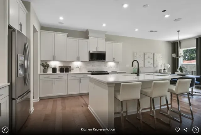a living room with fireplace furniture and a large window