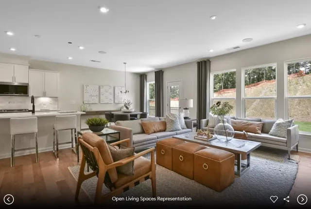 an aerial view of a house with garden space and lake view