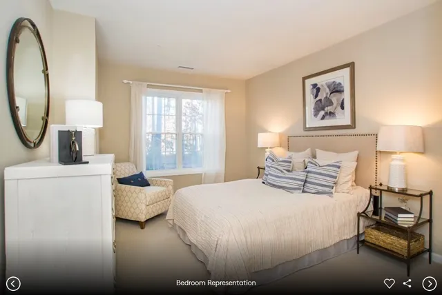 a bedroom with a bed and a tv on wall