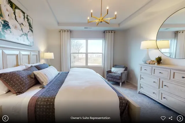 a living room with furniture and a view of kitchen