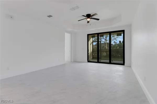 a view of an empty room with a window