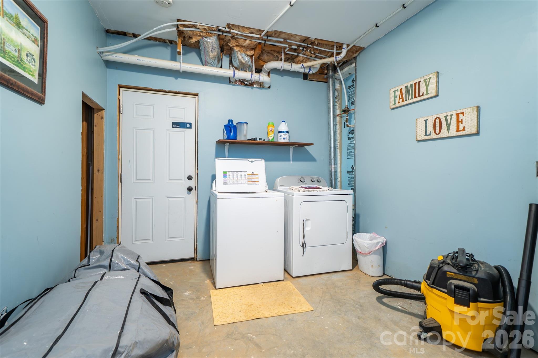 412 Masters View Drive Etowah, NC 28729 - Photo 22 of 30 a utility room with dryer and washer