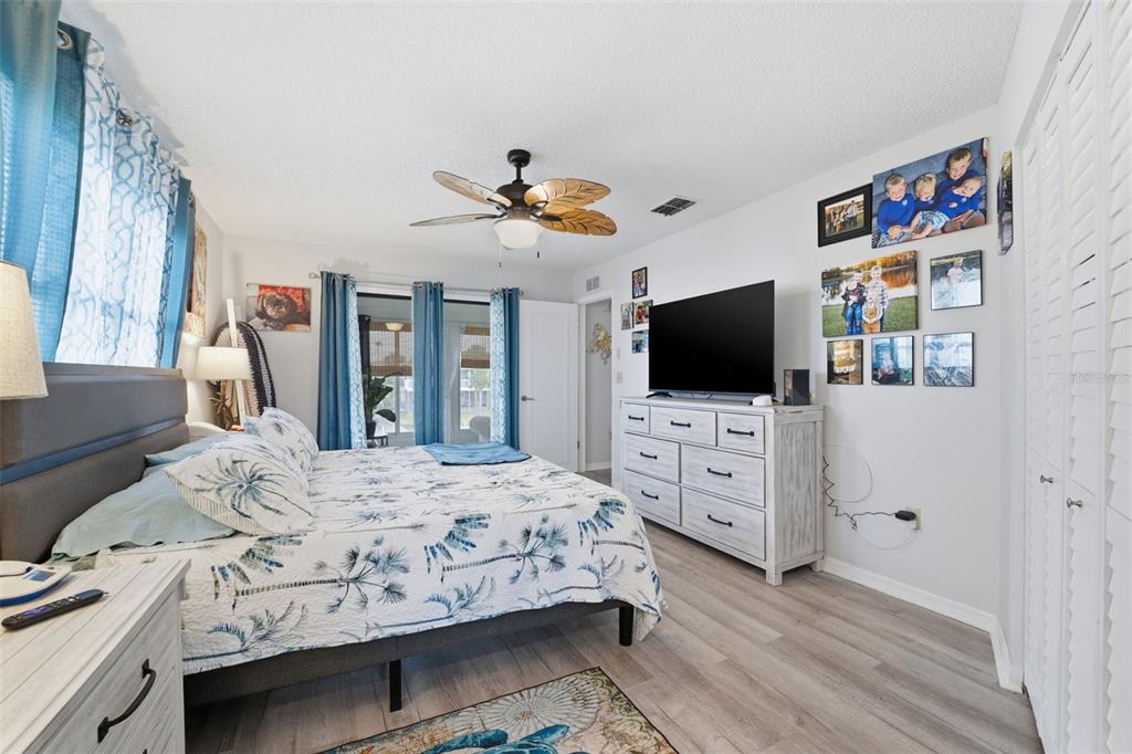3366 Bluefish Drive Hernando Beach, FL 34607 - Photo 68 of 75 a bedroom with a bed and a flat screen tv