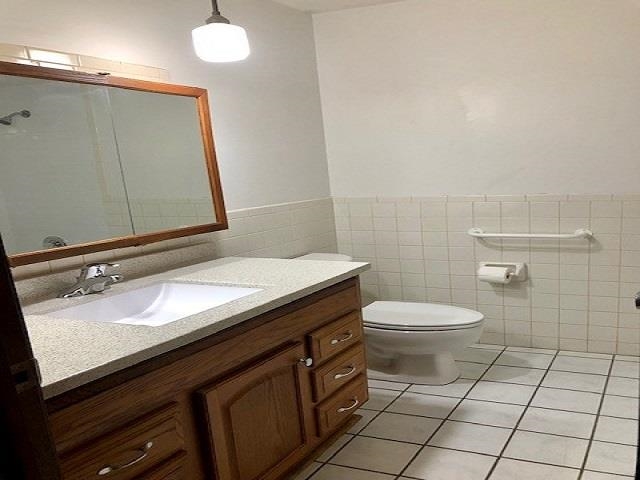 11255 Telegraph Road Pecatonica, IL 61063 - Photo 12 of 28 a bathroom with a granite countertop sink toilet and mirror