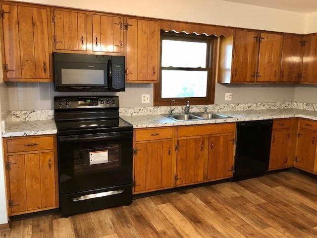 11255 Telegraph Road Pecatonica, IL 61063 - Photo 3 of 28 a kitchen with granite countertop a sink cabinets and stainless steel appliances