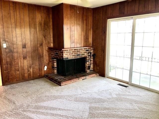 11255 Telegraph Road Pecatonica, IL 61063 - Photo 6 of 28 a view of an empty room with a fireplace and a window