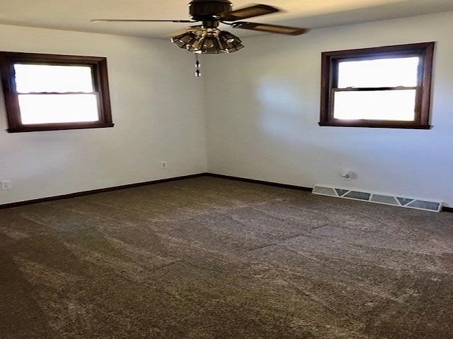 11255 Telegraph Road Pecatonica, IL 61063 - Photo 8 of 28 an empty room with a window