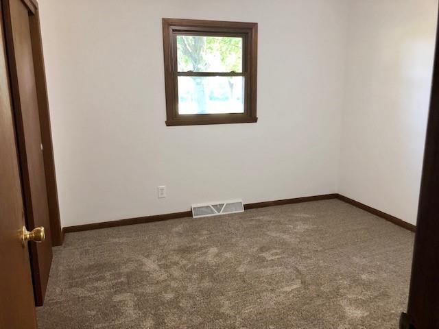 11255 Telegraph Road Pecatonica, IL 61063 - Photo 9 of 28 an empty room with a window