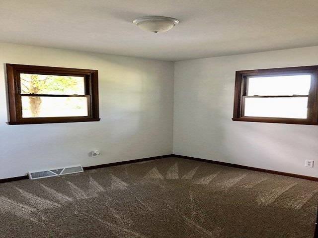 11255 Telegraph Road Pecatonica, IL 61063 - Photo 10 of 28 an empty room with a window