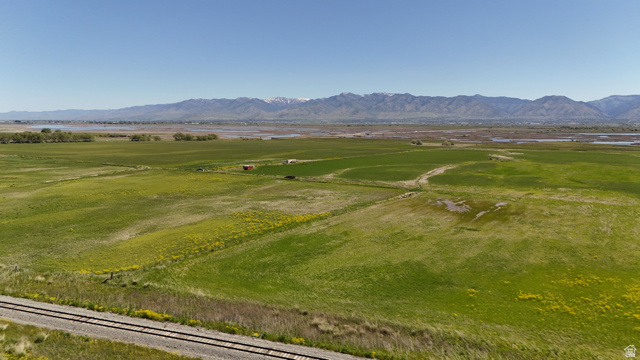 320 South 5400 West Logan, UT 84321 - Photo 28 of 42 Expansive green fields with distant mountains under a clear sky