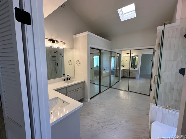 a living room with furniture a couch and a flat screen tv