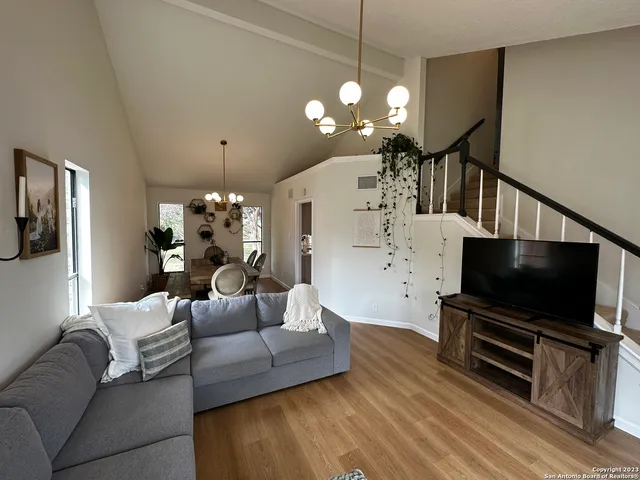 a kitchen with a sink a stove and cabinets