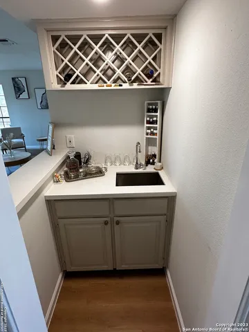 a bathroom with a double vanity sink mirror and shower
