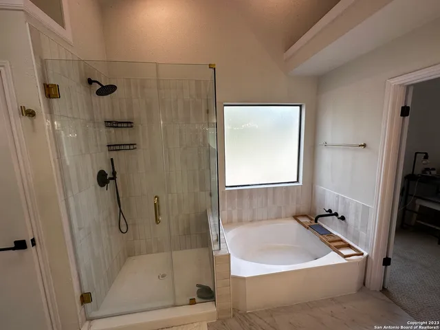 a bathroom with a sink double vanity and a mirror