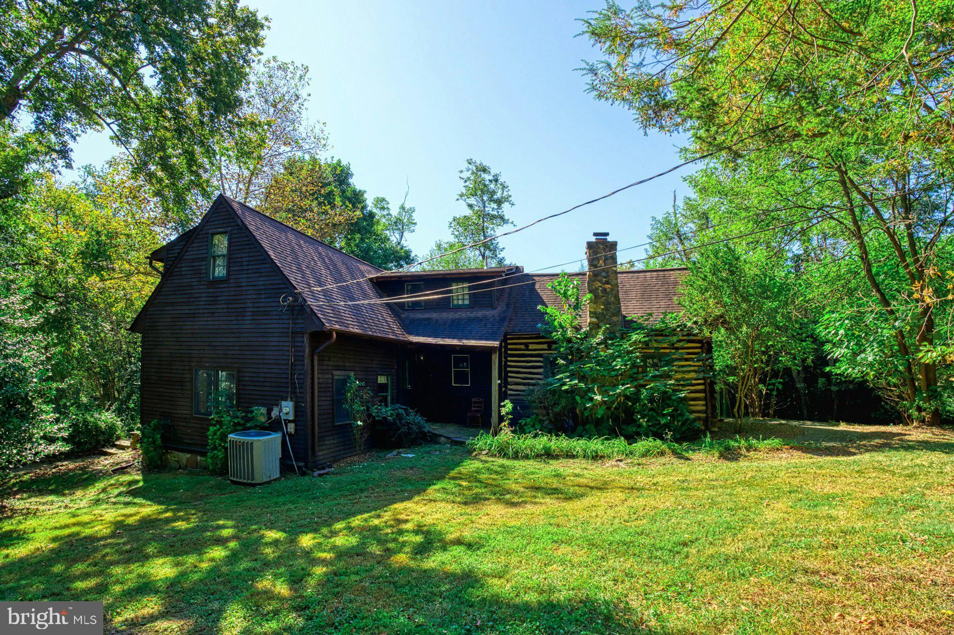 5250 Winfield Road Fairfax, VA 22030 - Photo 32 of 57 a view of a house with a yard plants and large tree