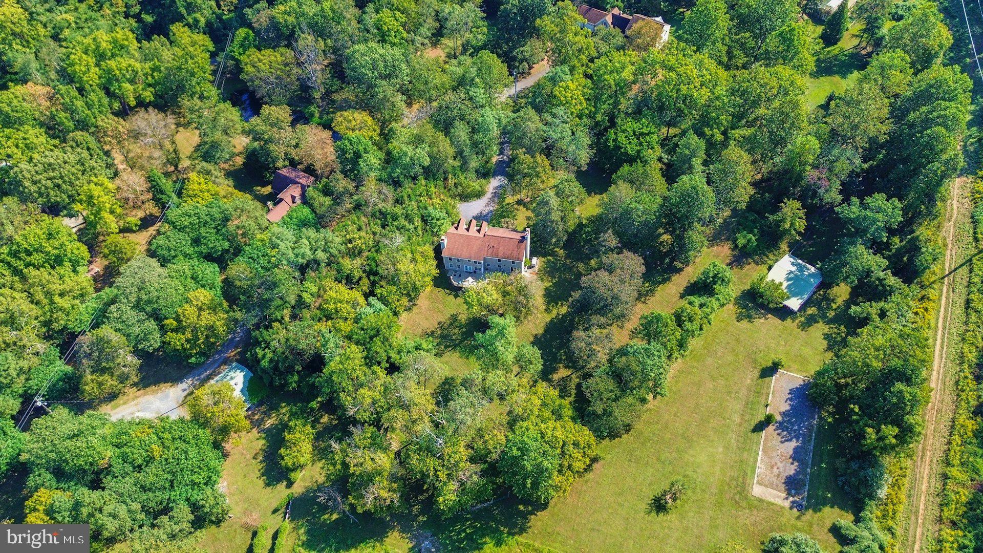 5250 Winfield Road Fairfax, VA 22030 - Photo 46 of 57 an aerial view of a house with a yard and lake view