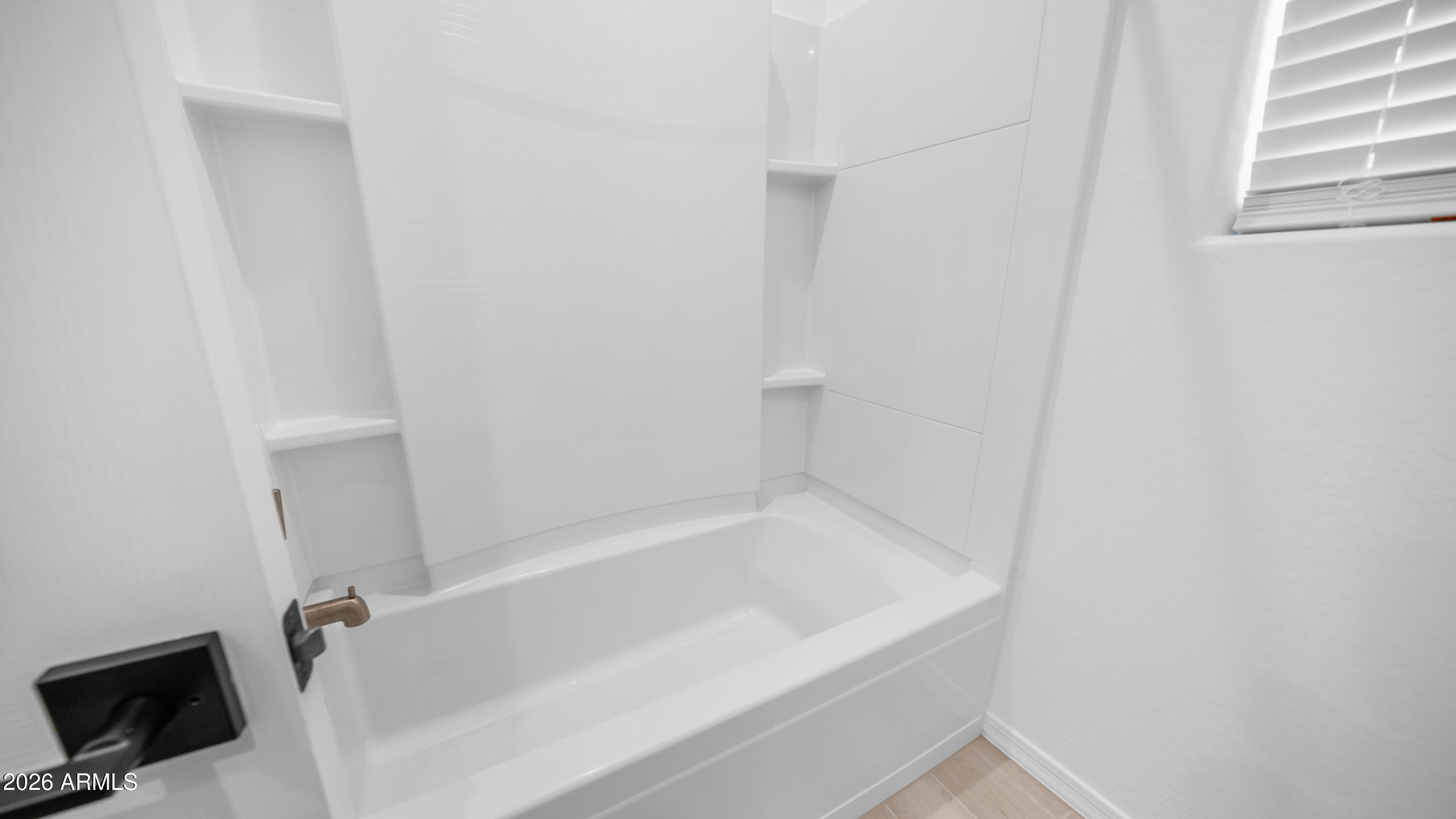 13362 West Eagle Feather Road Peoria, AZ 85383 - Photo 21 of 44 a close up of a bathtub in a bathroom