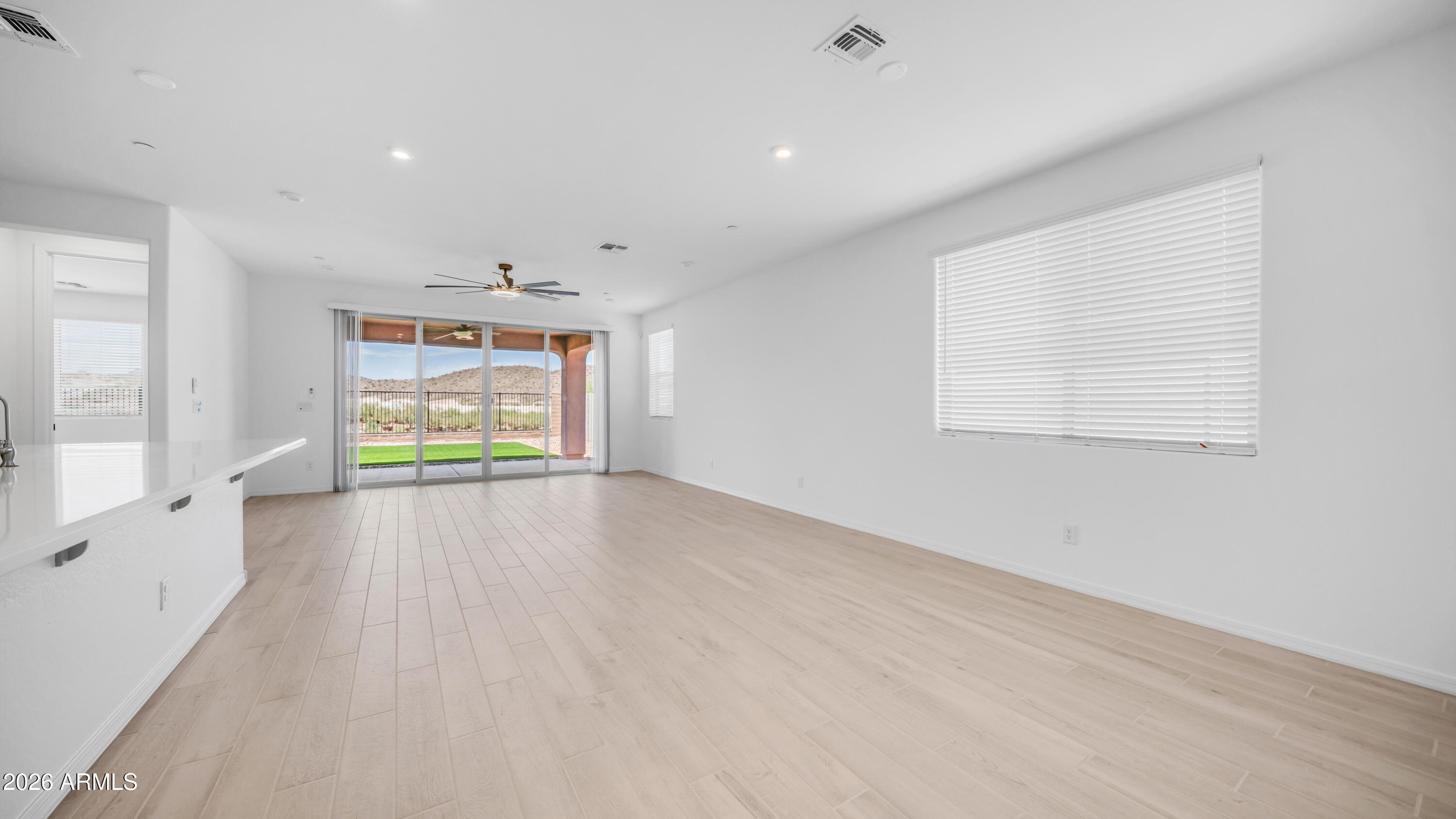 13362 West Eagle Feather Road Peoria, AZ 85383 - Photo 26 of 44 an empty room with windows and entrance