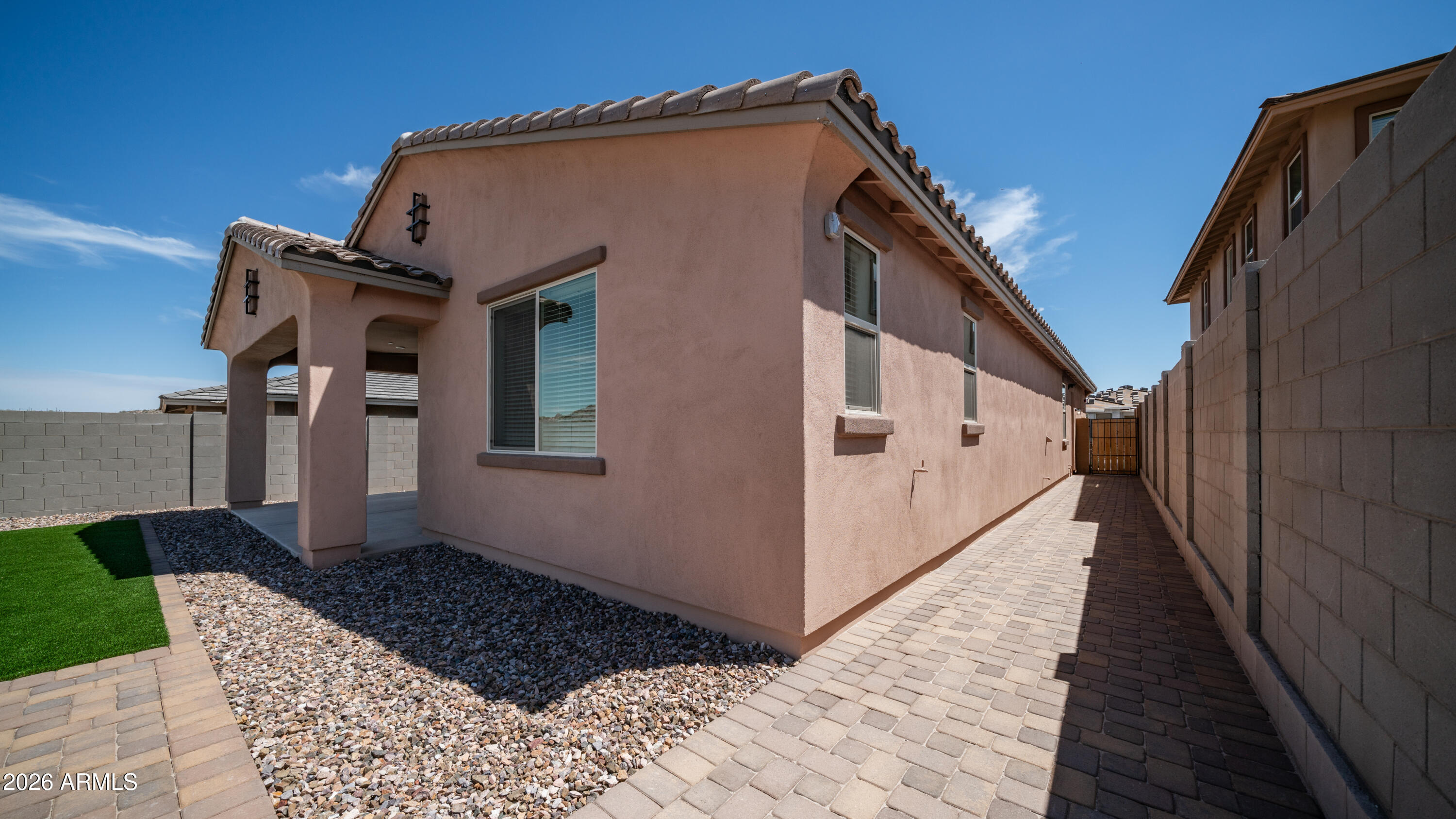 13362 West Eagle Feather Road Peoria, AZ 85383 - Photo 37 of 44 a front view of a house with wooden fence