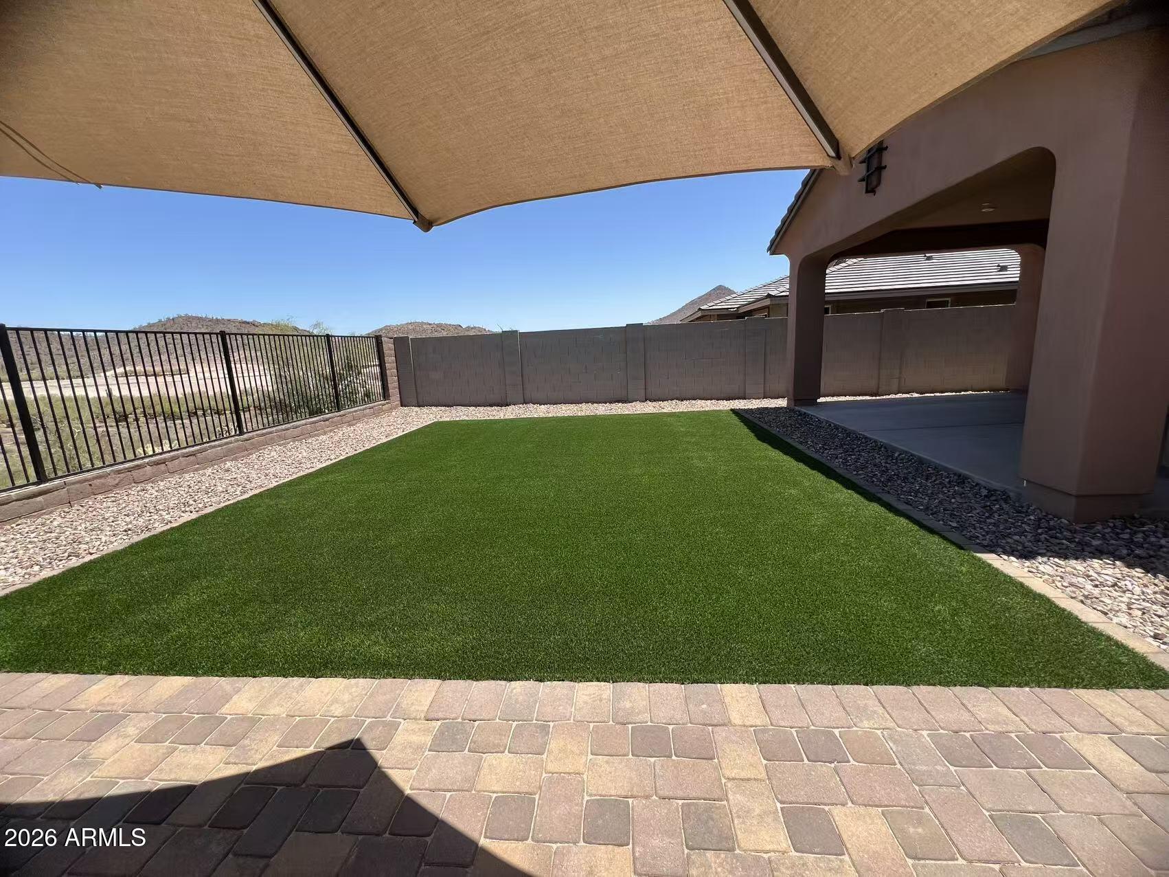 13362 West Eagle Feather Road Peoria, AZ 85383 - Photo 43 of 44 a view of an outdoor space and a yard