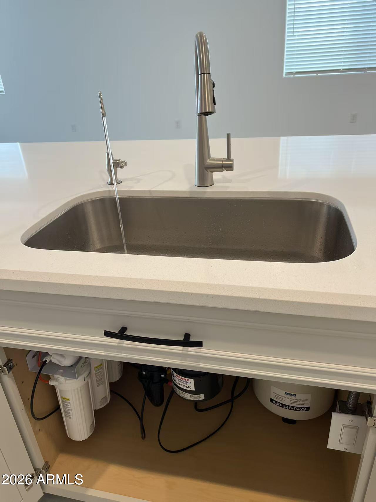 13362 West Eagle Feather Road Peoria, AZ 85383 - Photo 10 of 44 a close view of sink and tap