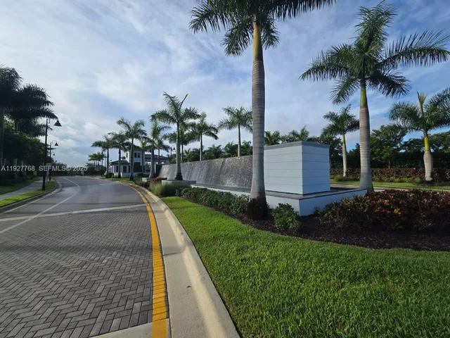 a view of a dining room with furniture and a flat screen tv