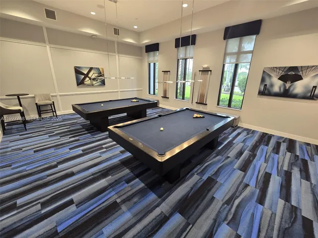 a view of a very nice looking dining room with furniture window and wooden floor
