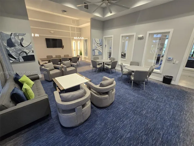 a room with lots of chairs and rug