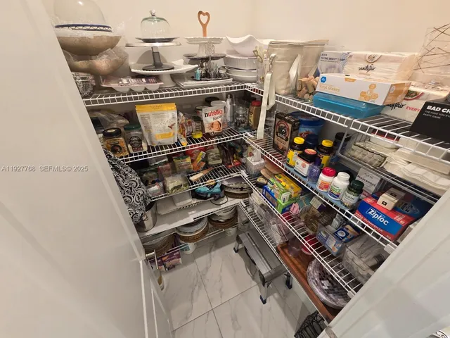 a bedroom with bed and wall painting