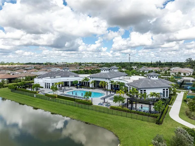a bedroom with a bed wooden floor and a window