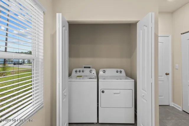a utility room with dryer and washer