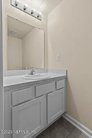 a sink with a mirror