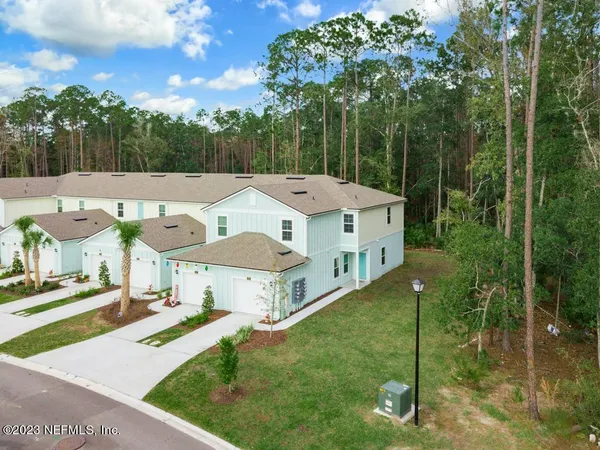 a aerial view of a house with a big yard