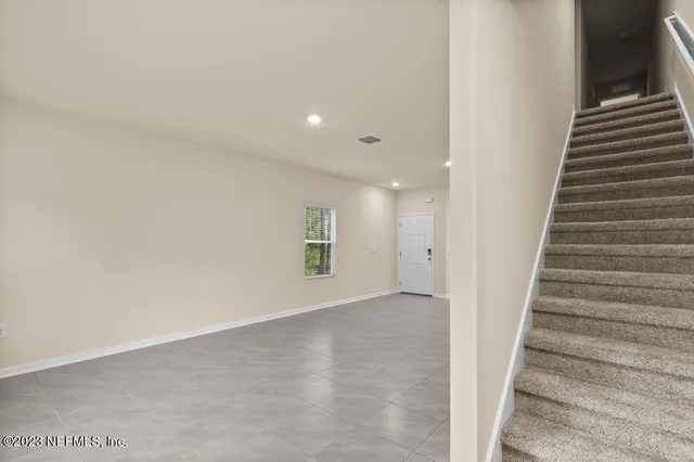 a view of an entryway with stairs