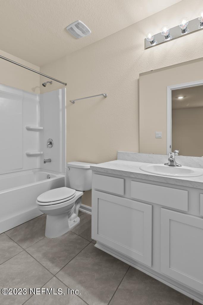 279 Talulla Trail St. Augustine, FL 32095 - Photo 26 of 52 a bathroom with a toilet sink and a mirror