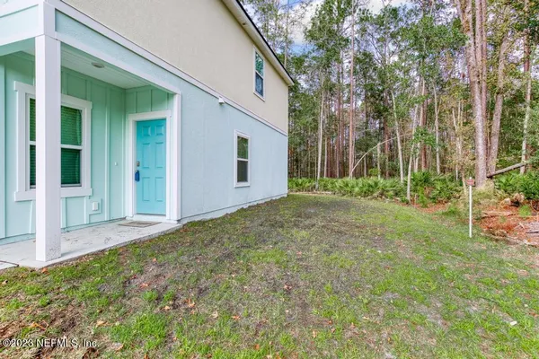 a backyard of a house with lots of green space