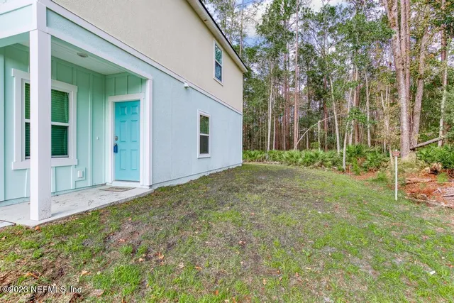 a backyard of a house with lots of green space
