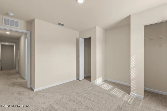 a view of a park with a tree in the background