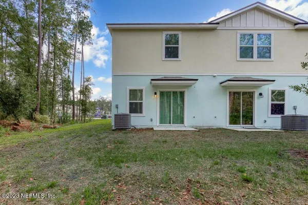 a view of a house with backyard and garden