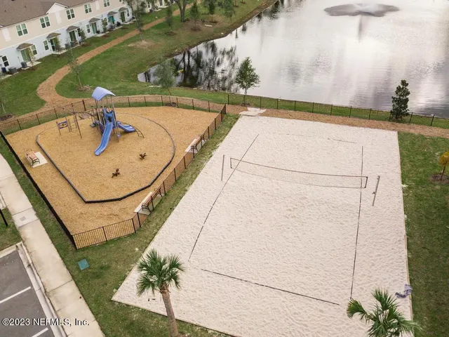 a view of a swimming pool with a yard